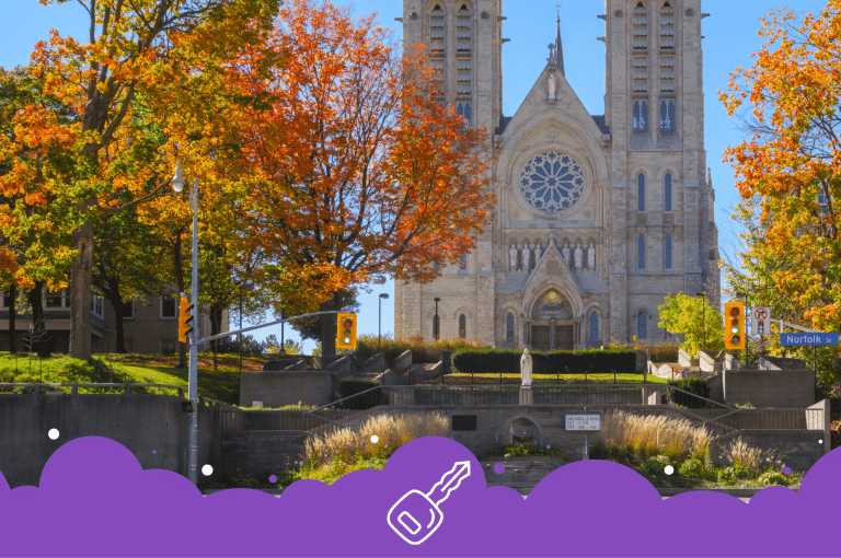 a building with trees and a stone wall