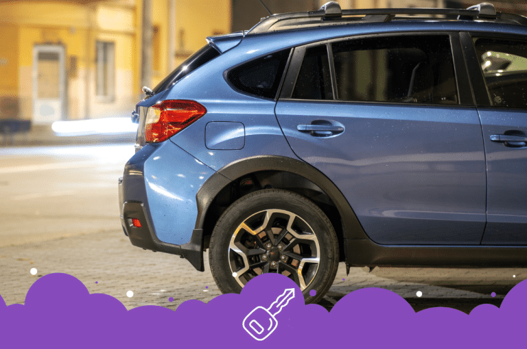 a blue car parked on a brick road
