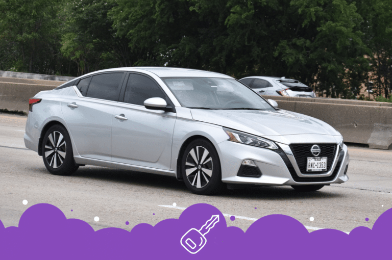 a silver car on the road