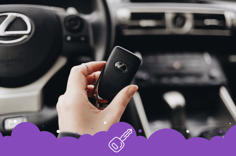 a hand holding a key in a car