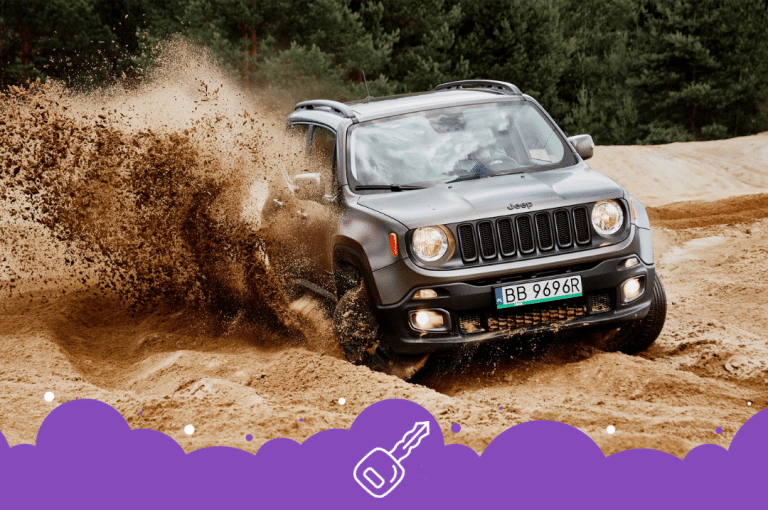 Gray jeep renegade driving in the dirt