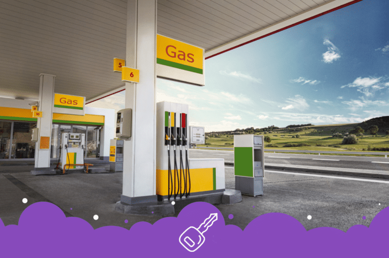 a gas station with a sign and a road