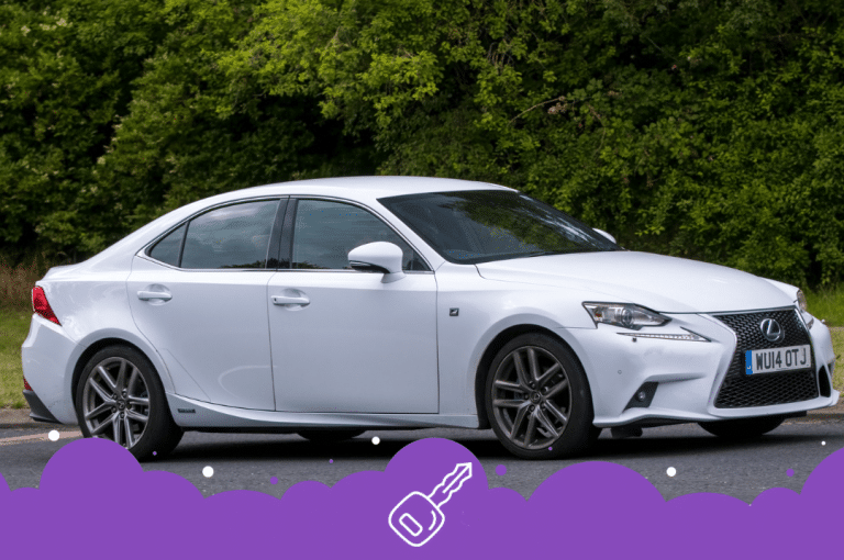 a white car parked on the side of a road