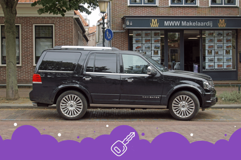 a black car parked on the side of a street