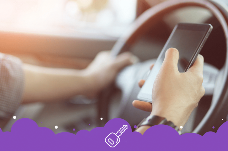 a person holding a phone while driving