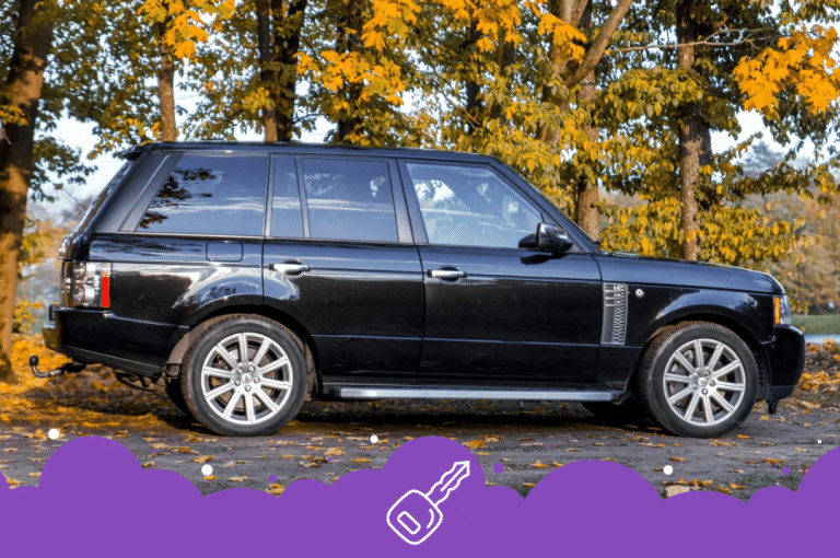 a black car parked on the side of a road