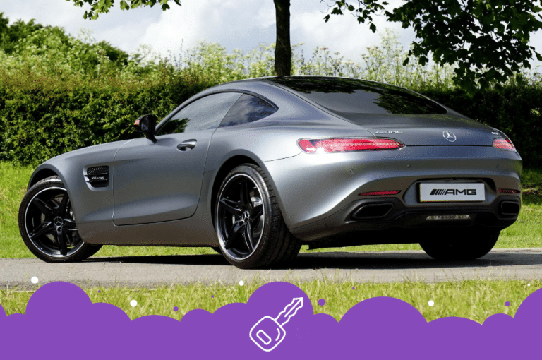 a silver car parked on a road