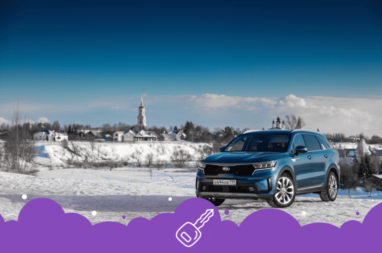 Blue Kia sorento in the snow