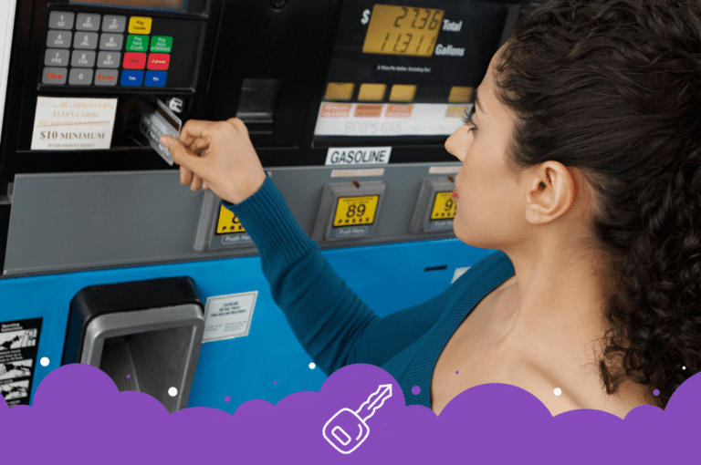 a woman using a card to pay at a gas station