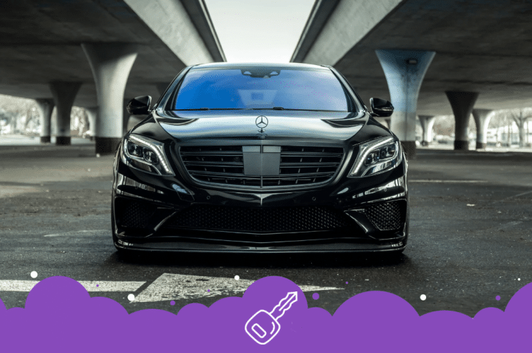 a black car parked under a bridge
