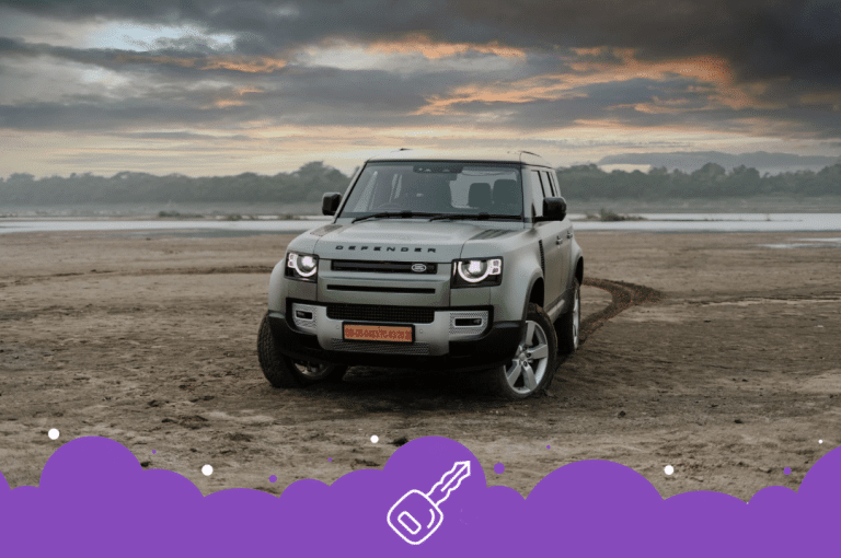a car parked on a sandy area