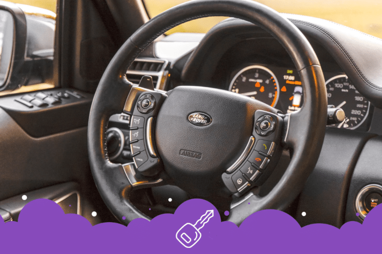 a steering wheel and dashboard of a car