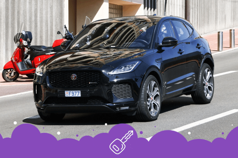 Black jaguar e pace moving on the street