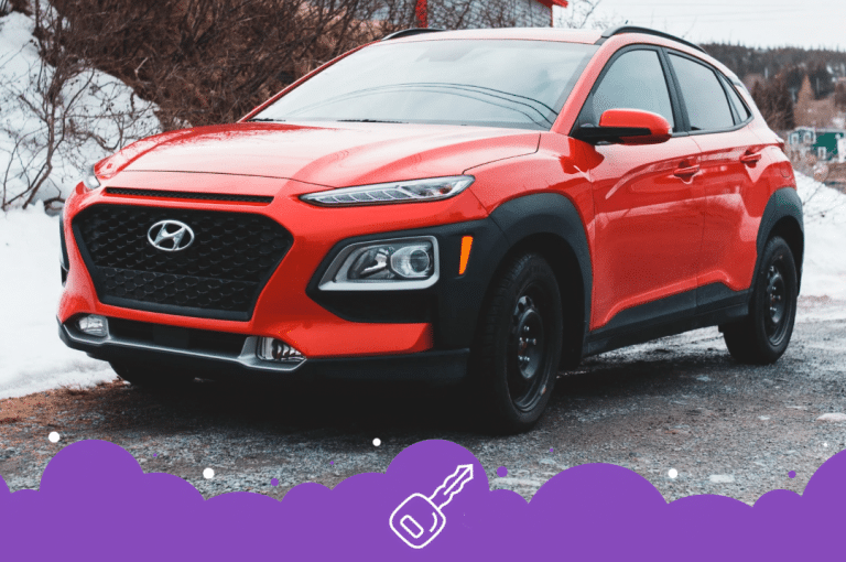 Red Hyundai kona parked on the side of the road