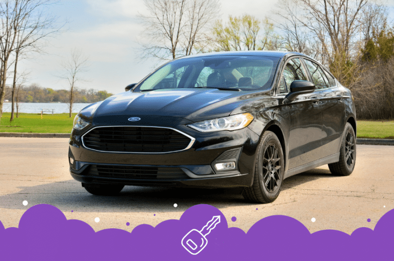 Black ford fusion ina parking lot