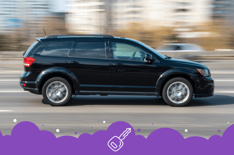 Black dodge journey driving in motion