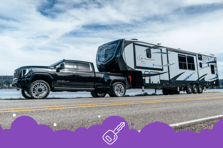 Black gmc sierra towing trailer