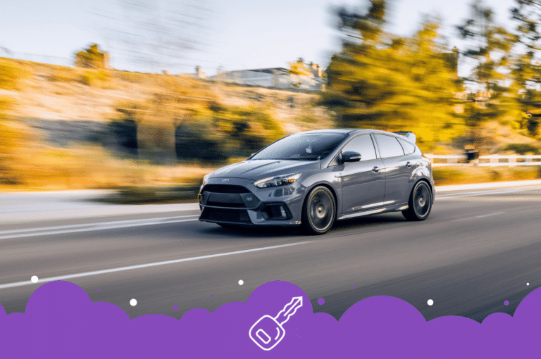 Gray ford focus driving blurred background