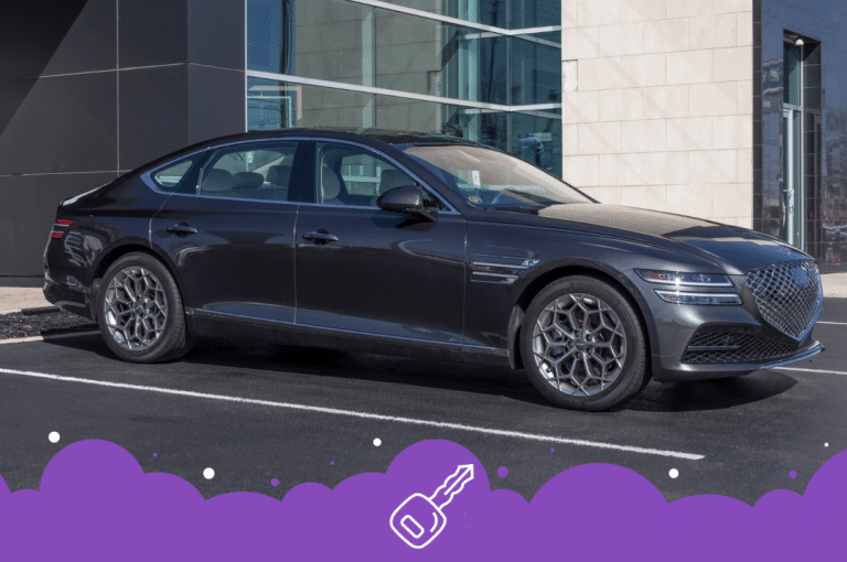 Grey genesis g80 infront of dealership