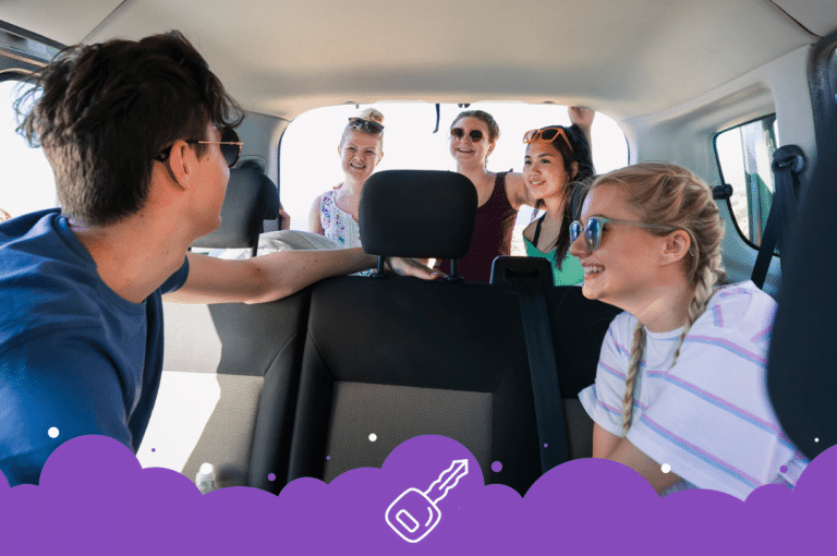 Smiling friends inside mini van