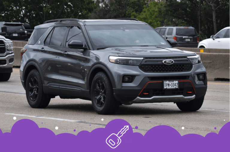 Gray ford explorer on road