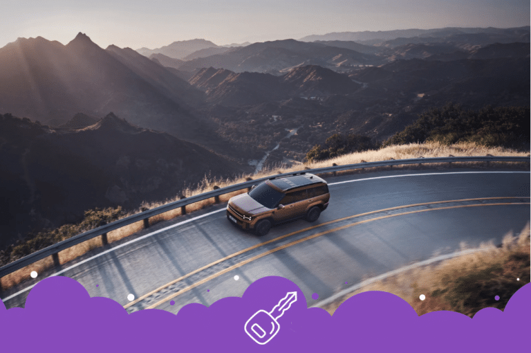 Brown Hyundai Santa Fe driving by mountains