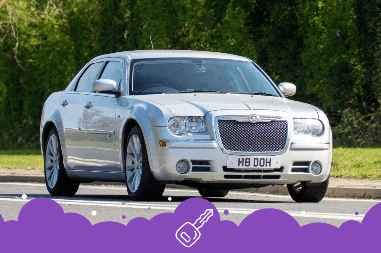 Silver Chrysler 300 driving on road