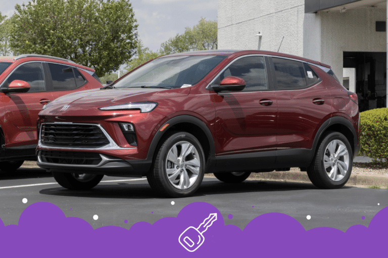Red Buick suv parked in front of dealership