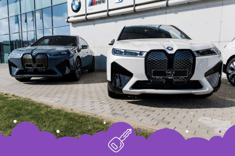 2 electric bmw SUVs parked in front of dealership