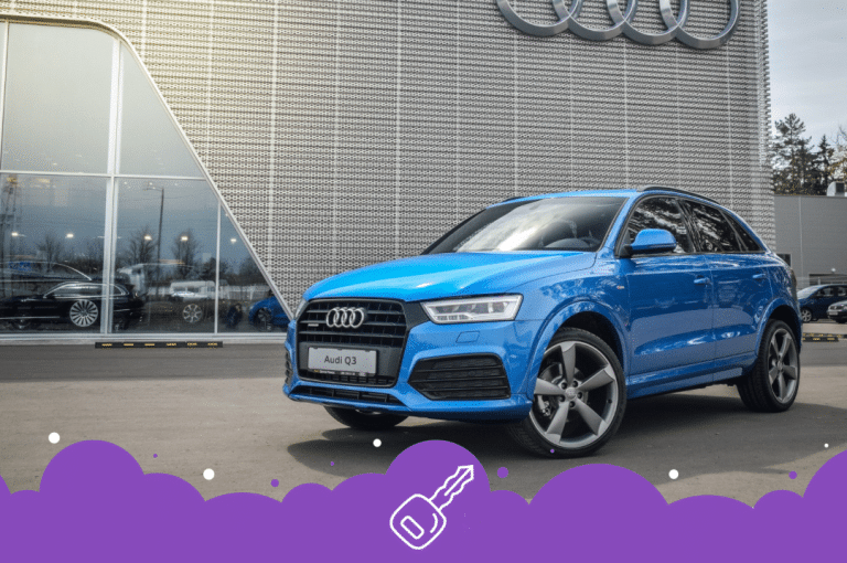 Blue Audi q3 parked infront of dealership