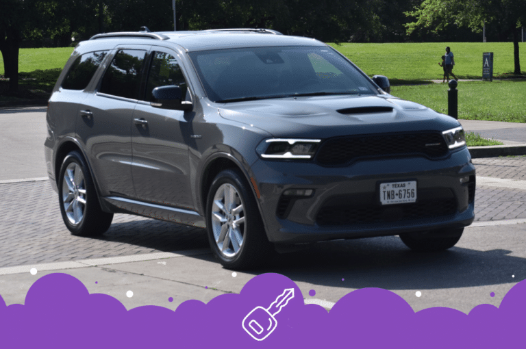 Grey dodge Durango driving