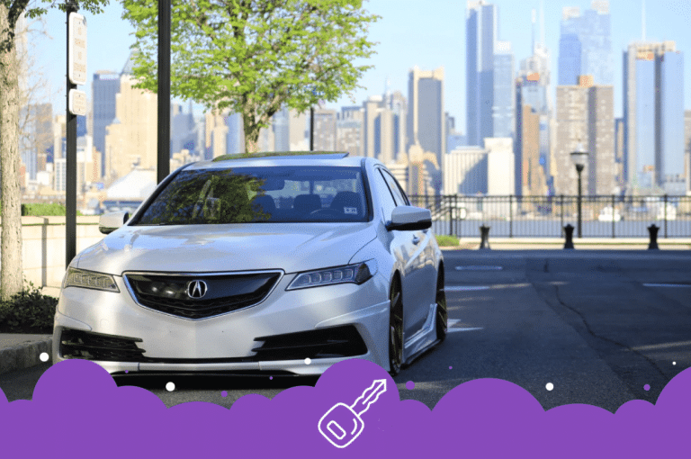 a white car parked on a road with a city in the background