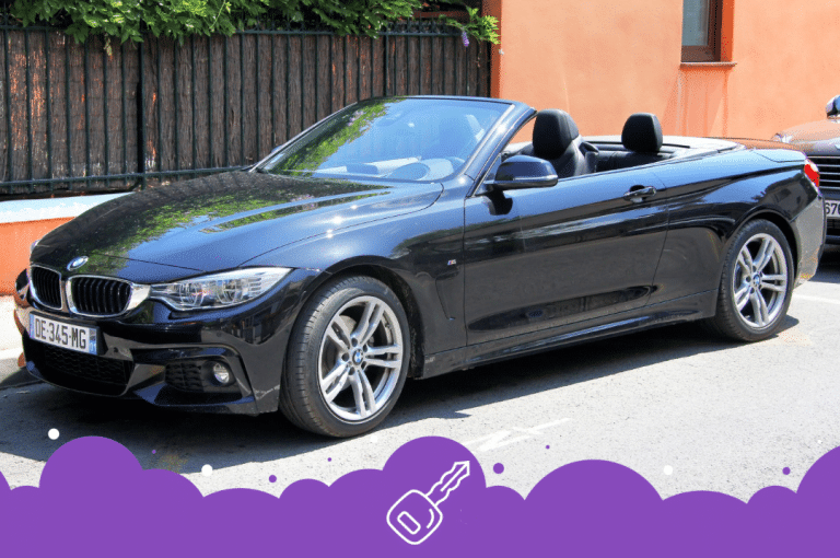 Black convertible 4 series parked on side of the road