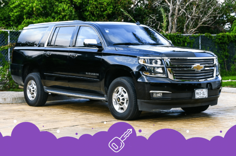 Black Chevy suburban parked in parking lot