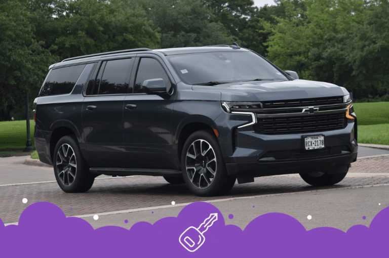 Gray chev suburban driving