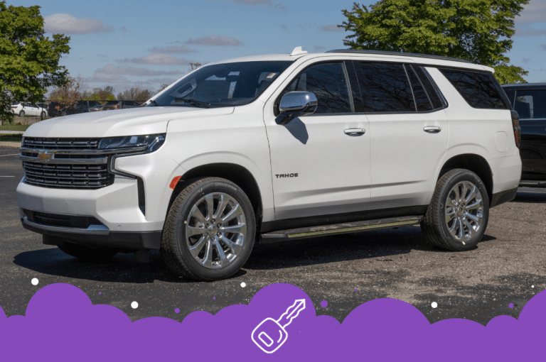 White Chevy Tahoe parked in lot