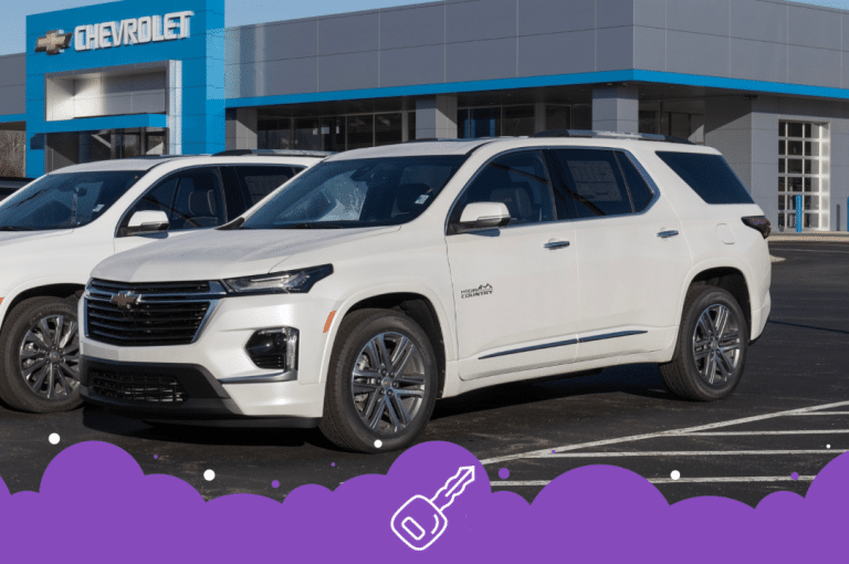 White Chevy traverse infront of dealership