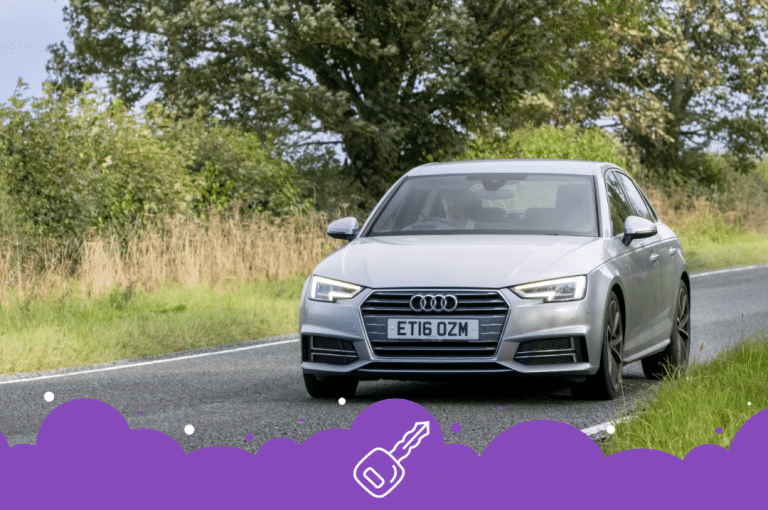 Silver Audi a4 driving through trees