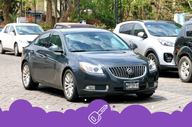 Black Buick regal driving on road