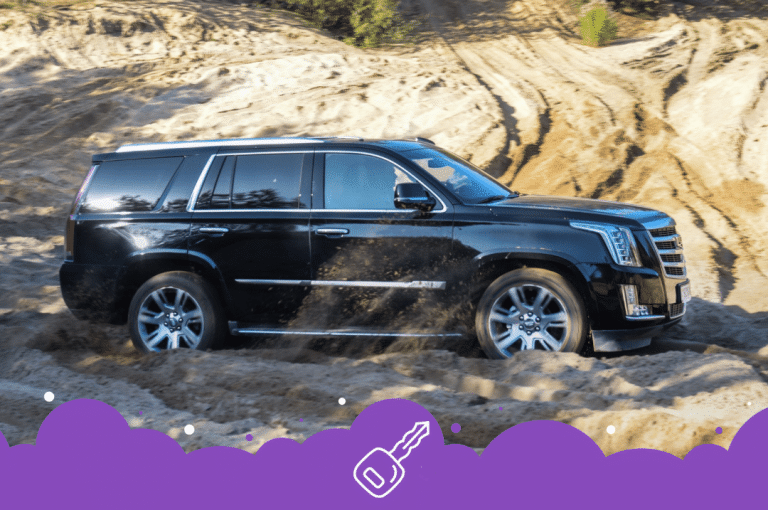 Black Escalade driving through dirt