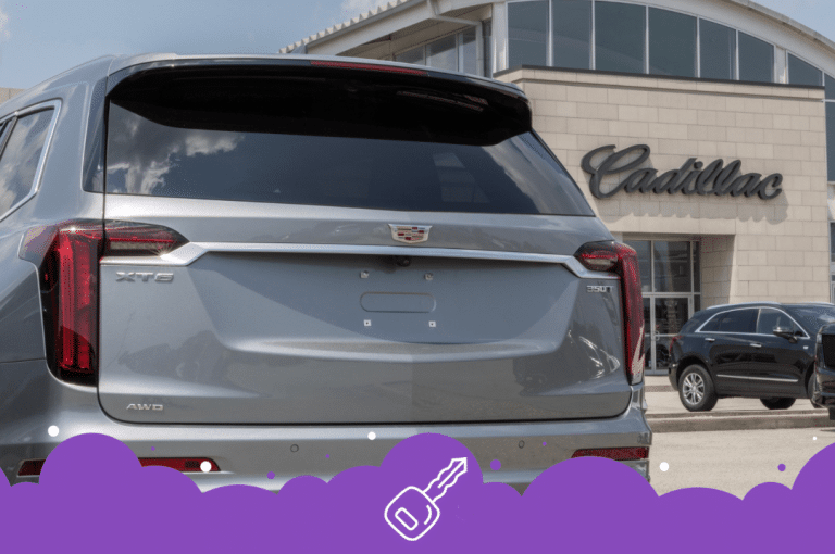 Gray caddy xt6 parked infront of dealer