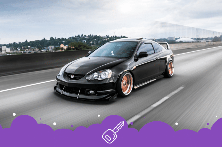 Black acura Rsx driving on road