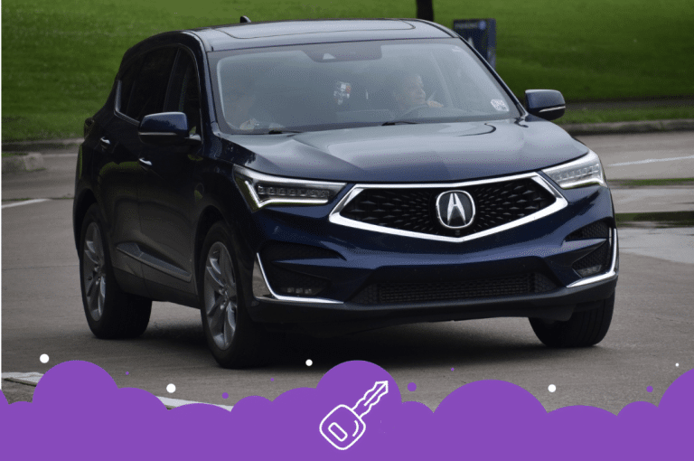 Navy blue acura RDX driving