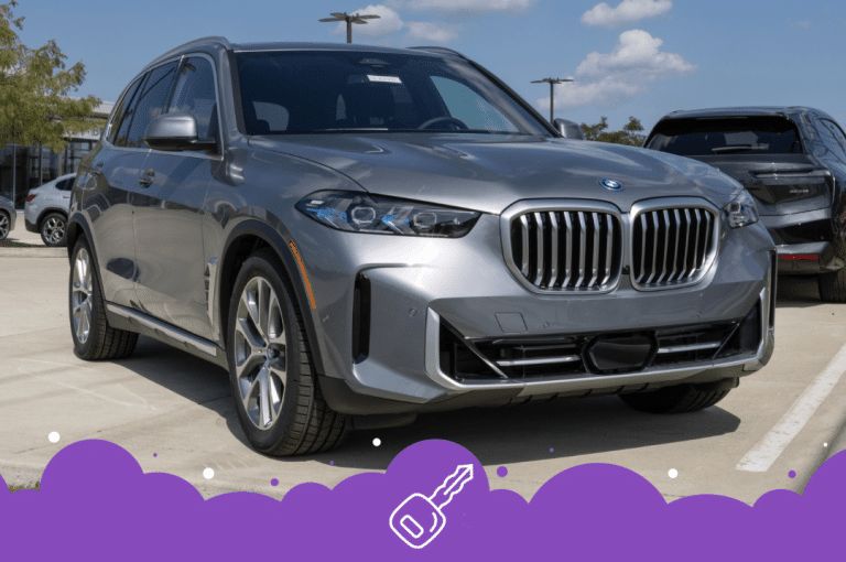 BMW x5 grey in dealer parking lot