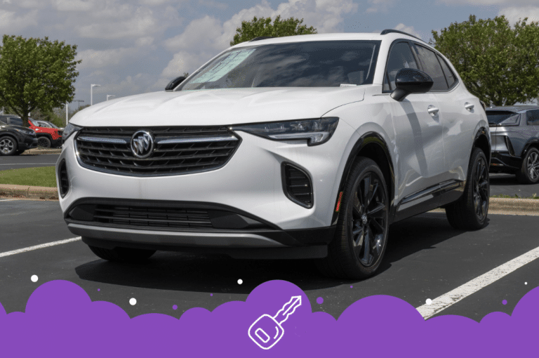 White Buick envision parked in dealer lot