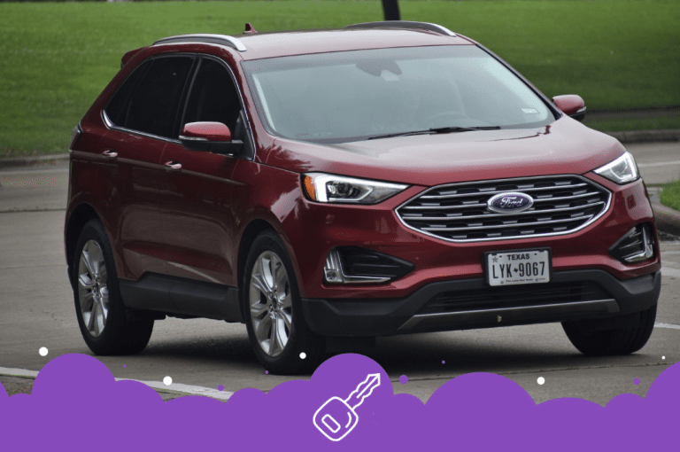 Red ford edge driving by park