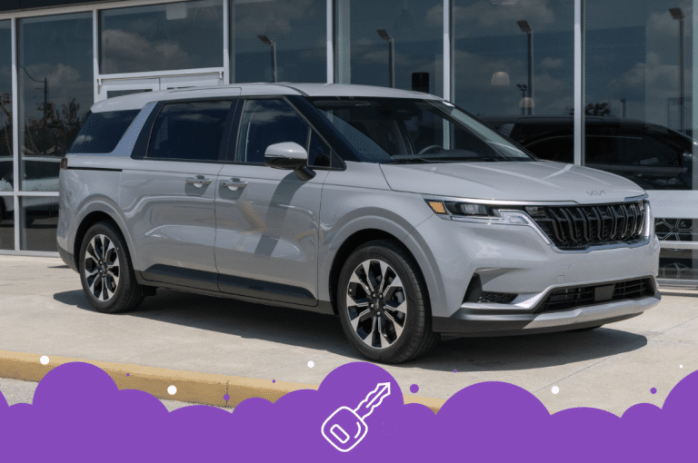 Flat grey Kia carnival parked at dealer