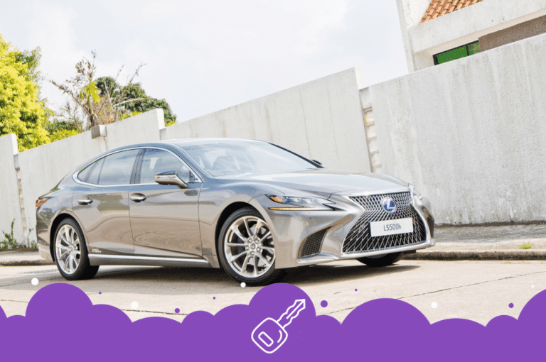 Grey Lexus es parked on side of the road