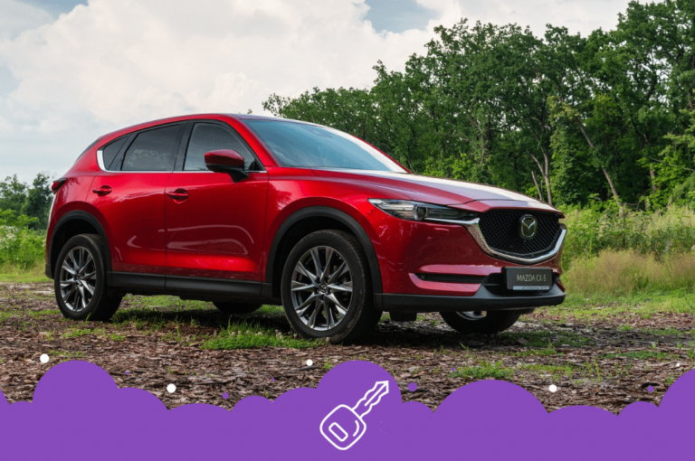Red Mazda cx5 on forest road