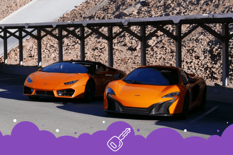 2 orange sports cars parked in lot